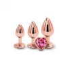 Kuldsete anaaltappide komplekt roosade südamekujuliste kividega 3 tk